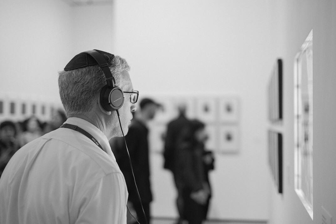 Slovenian male studio director wearing a headset, studio portrait